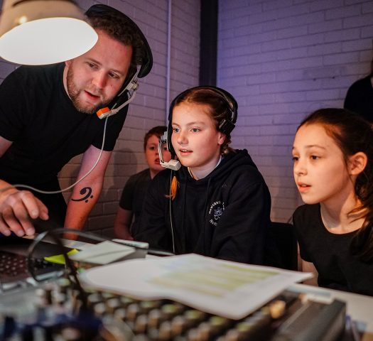 Sound and Lighting Technician Alex Day teaching young people on the RSC Next Generation project