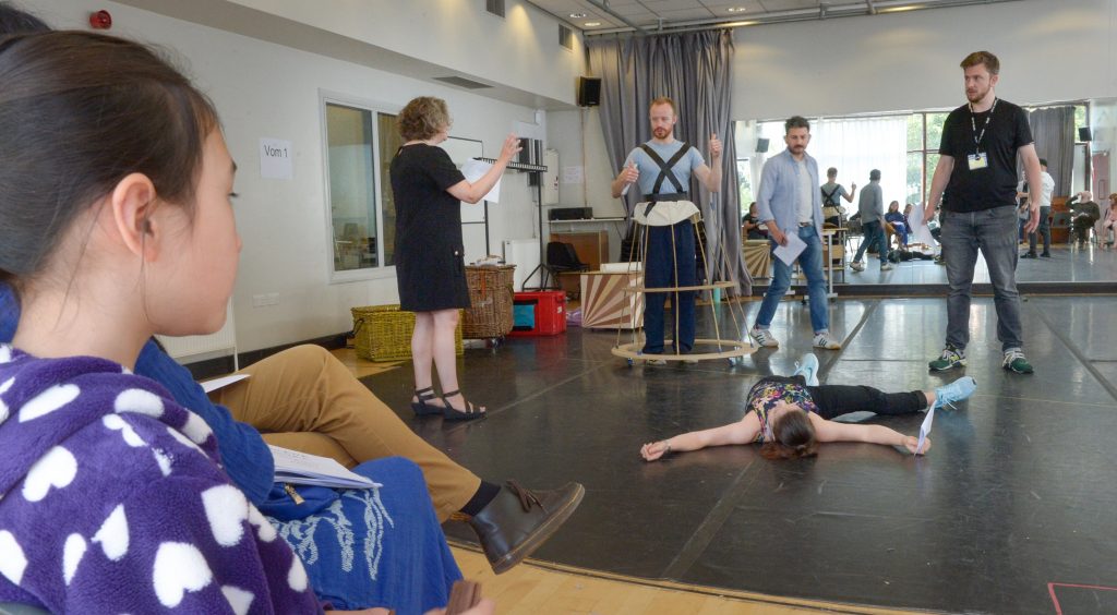 A child watches an open rehearsal for the New Vic's 2019 Christmas show The Prince and the Pauper.