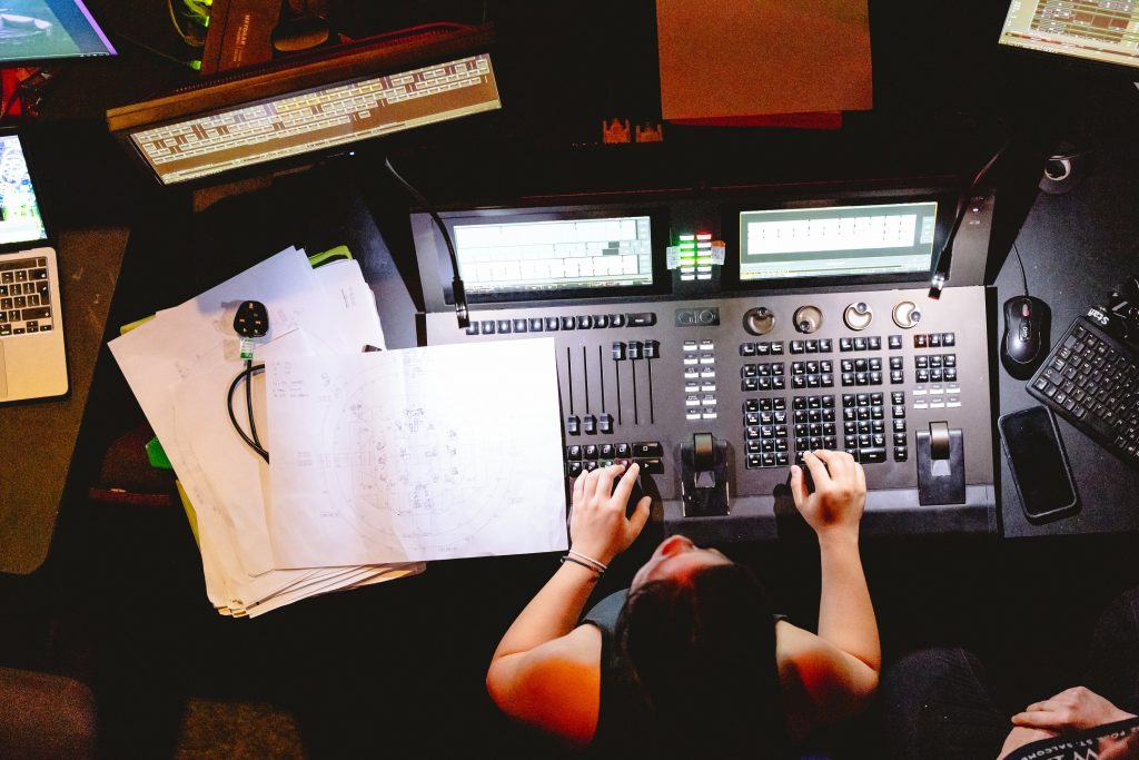 A Kiln Sparks participant acts as a lighting operator programming the lighting desk. Credit Andrew Billington