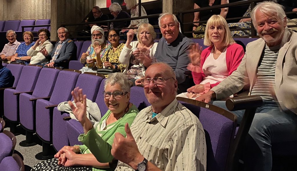 The group enjoyed watching comedy Ladies' Day at the New Vic earlier this year. Here they are getting comfortable in the auditorium. 