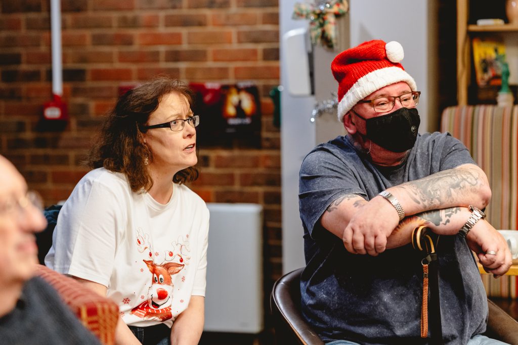 Members of the Next Chapter group look thoughtful as they guess a charade. Picture from Next Chapter Christmas quiz night in the New Vic bar. Credit: Andrew Billington