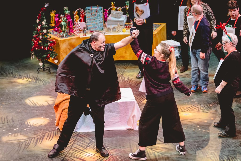The mouse king and girl in a Christmas jumper are in a battle. Picture from the Strathcross version of The Nutcracker 2023. Credit: Andrew Billington