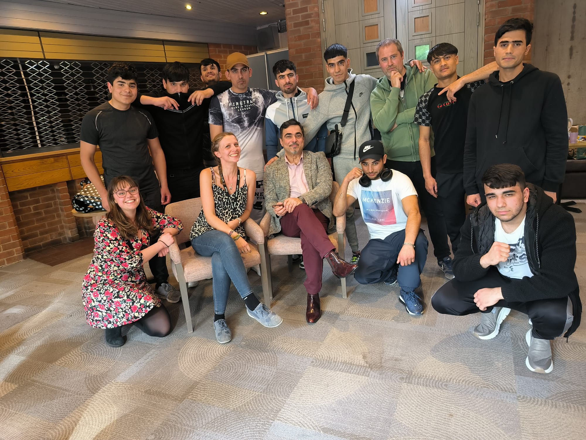 Some of the Brighter Horizons participants and New Vic Borderlines practitioners pose for a group photo in the Lounge at the New Vic Theatre